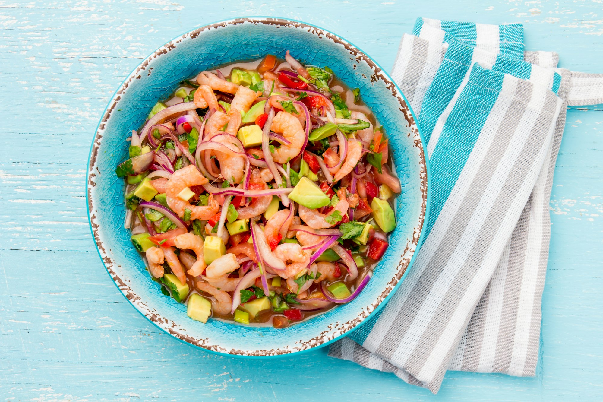 Mexican shrimps ceviche sebiche with tomatoes and avocado